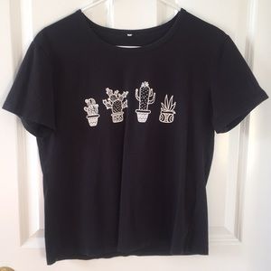 black t shirt with cacti designs on front